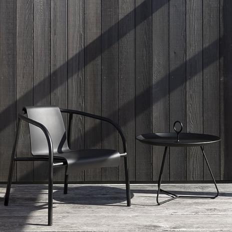 NAMI outdoor lounge chair with armrests, shell made from plastic waste, by HOUE